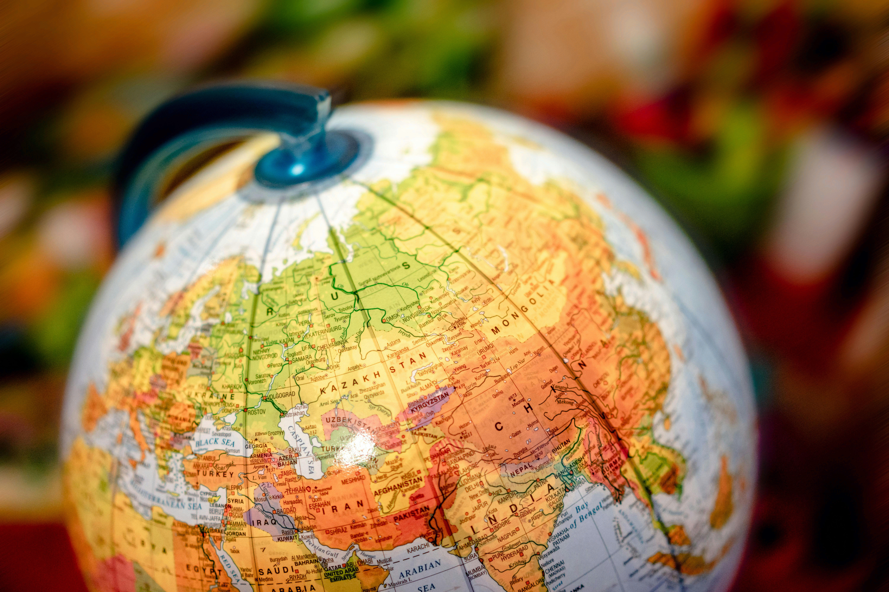 World map globe showing international distribution regions